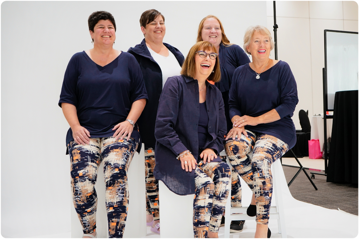5 women laughing and posing for a picture in their She's Got Leggz leggings and tops